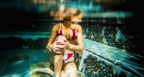 arenal woman sitting underwater costa rica